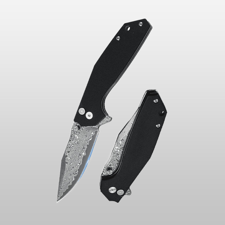 Folding knife with black handle and silver blade on a gray background