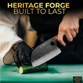 Person using a knife to cut a cucumber with 'Heritage Forge' branding in the background.