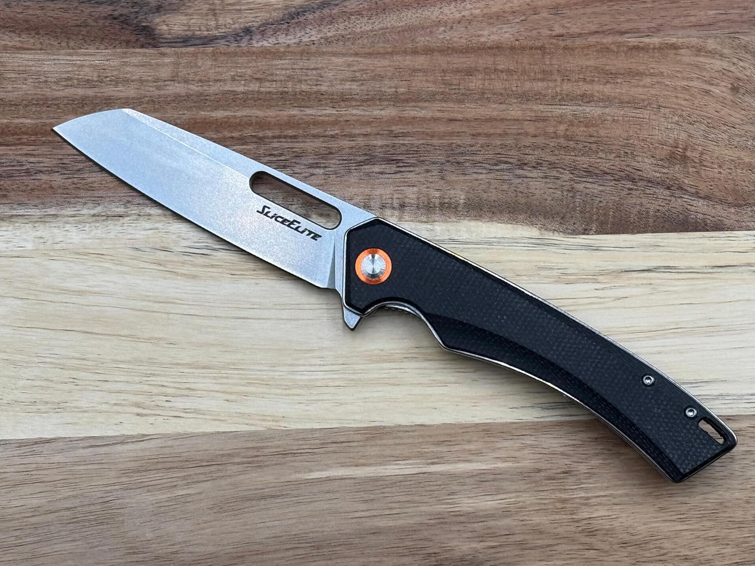 Compact sheepsfoot D2 EDC knife with micarta handle.