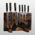 Set of seven knives with black handles on a wooden magnetic  block against a white background