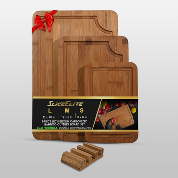 Set of wooden cutting boards with a red bow on a white background