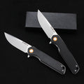 SliceElite Black folding pocket knife with silver blade and orange pivot accents, shown next to its packaging