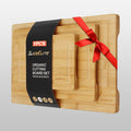 Set of three wooden cutting boards with a red ribbon and Slice Elite packaging on a light gray background
