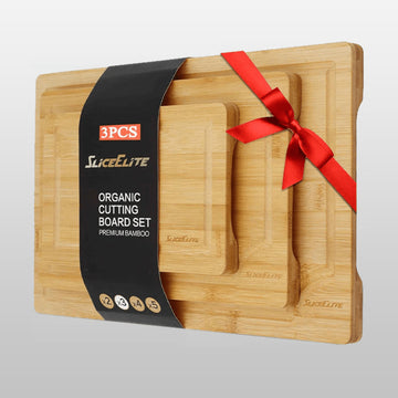 Set of three wooden cutting boards with a red ribbon and Slice Elite packaging on a light gray background