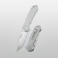 Folding knife with a metallic blade and handle on a light gray background