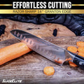 SliceElite Santoku knife slicing through a fresh carrot, with sliced carrot pieces placed on a wooden surface.